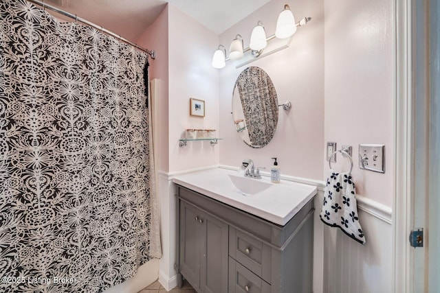 bathroom with vanity and curtained shower