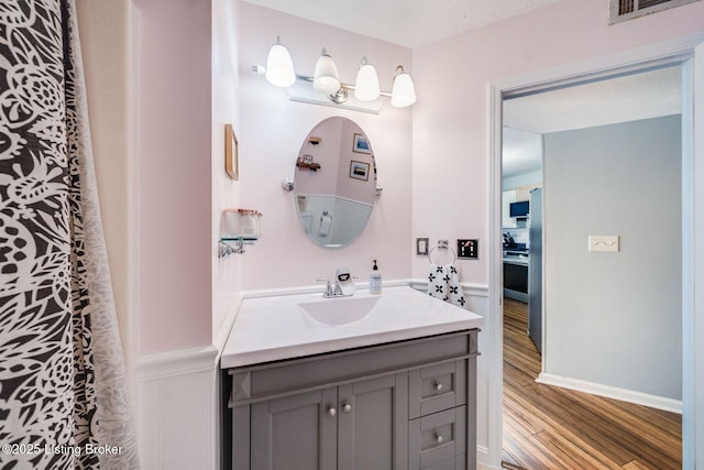 bathroom featuring vanity and a textured ceiling