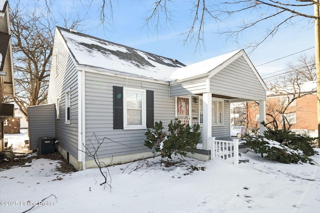 bungalow-style house with central AC and a porch