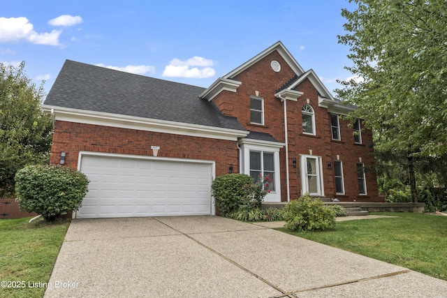 view of front of property with a garage and a front yard