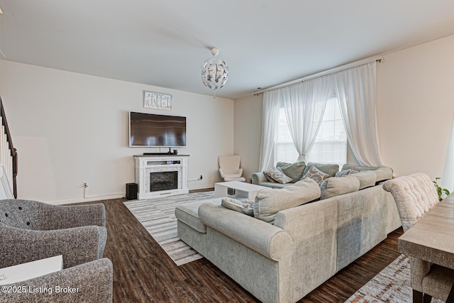 living room with dark hardwood / wood-style floors