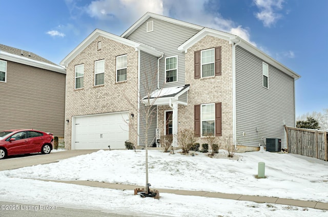 view of property with cooling unit and a garage