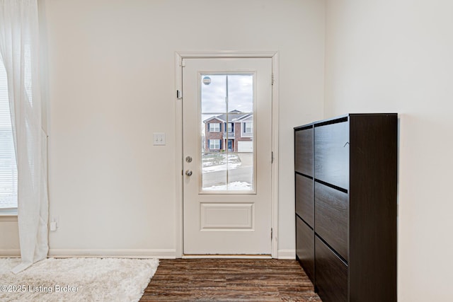 doorway featuring dark hardwood / wood-style flooring