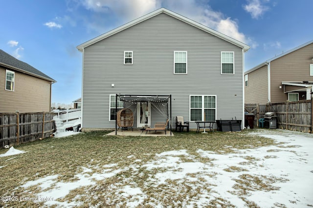 snow covered house featuring a patio area and a pergola