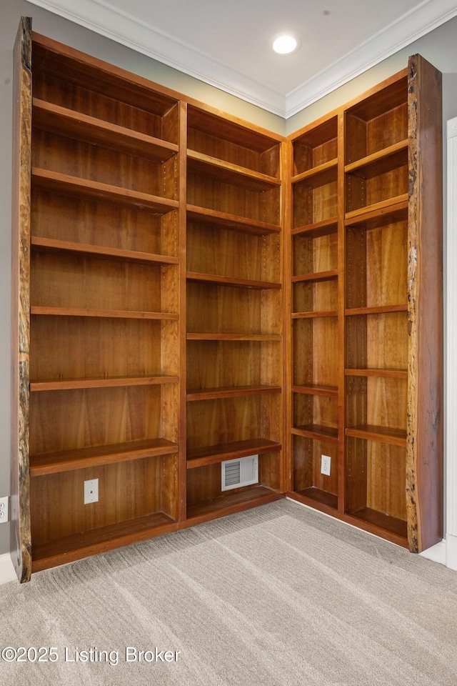 carpeted empty room featuring ornamental molding, recessed lighting, and visible vents