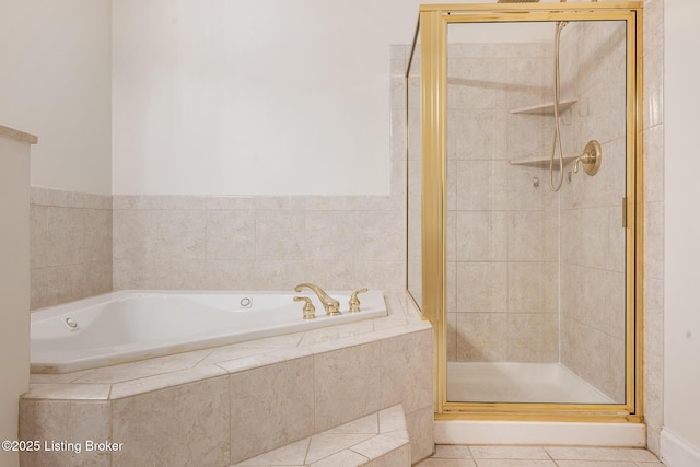 full bathroom featuring a garden tub, a shower stall, and tile patterned floors