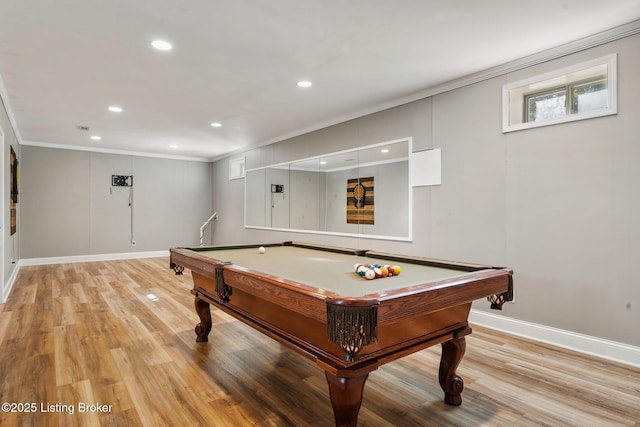 rec room with billiards, ornamental molding, and light hardwood / wood-style floors