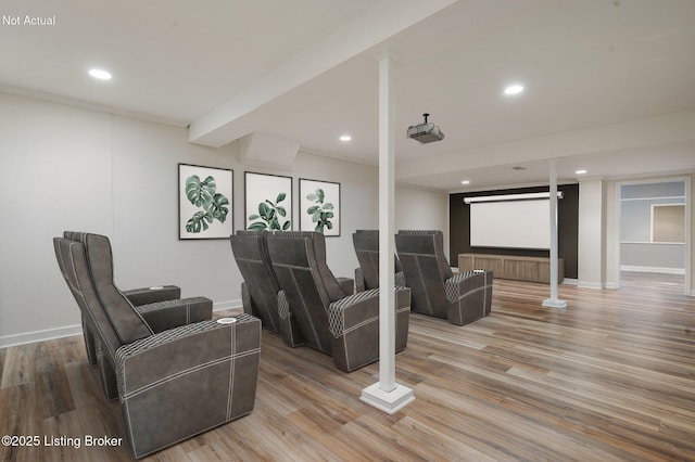 home theater room with recessed lighting, baseboards, and wood finished floors