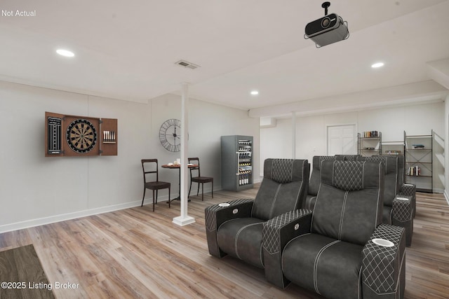 cinema with baseboards, recessed lighting, visible vents, and light wood-style floors