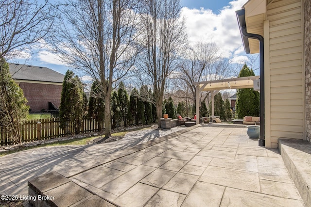 view of patio featuring outdoor lounge area and fence