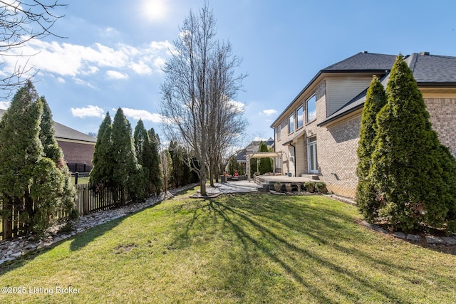 view of yard with a patio and fence