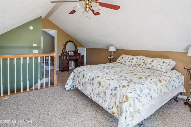 carpeted bedroom with a textured ceiling, ceiling fan, and lofted ceiling