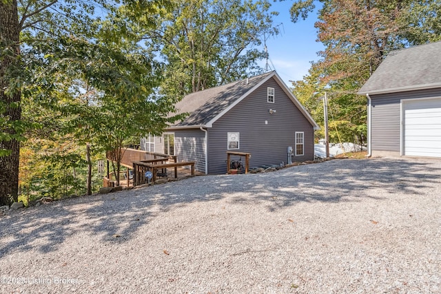 view of side of property featuring a garage