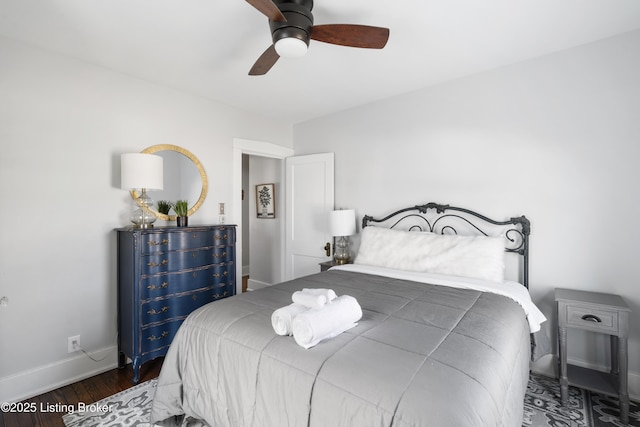 bedroom featuring ceiling fan and dark hardwood / wood-style floors