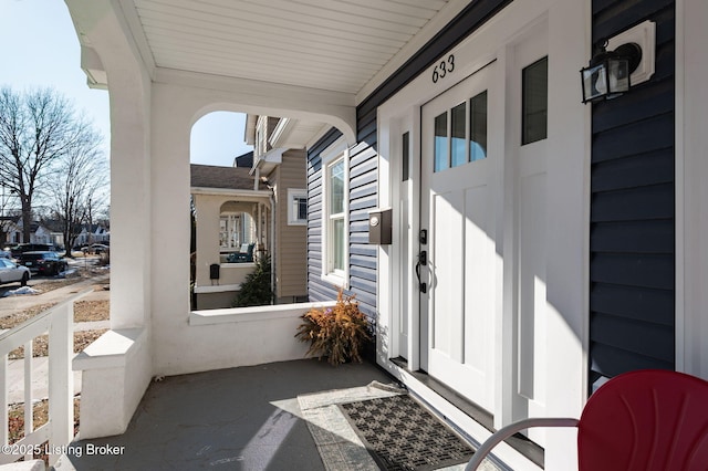 view of exterior entry featuring a porch