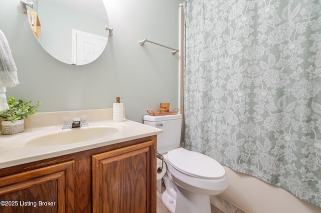 bathroom with toilet and vanity