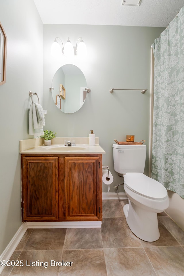 bathroom with vanity, toilet, and a shower with shower curtain