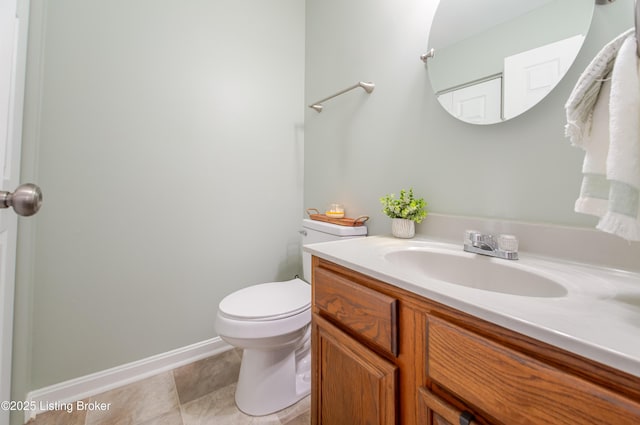 bathroom featuring toilet and vanity