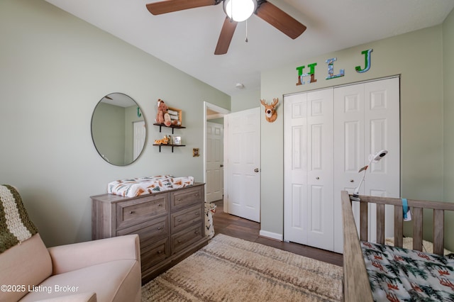 bedroom with ceiling fan, dark hardwood / wood-style floors, and a closet