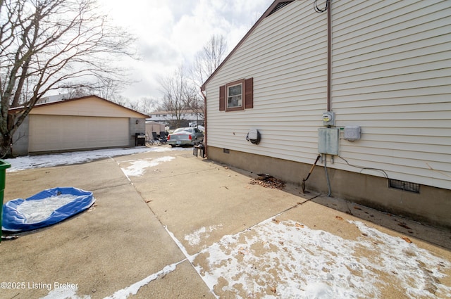 view of home's exterior featuring an outbuilding and a garage