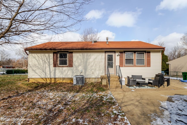 rear view of property featuring a patio area, central AC unit, and an outdoor hangout area