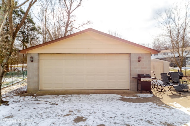 view of snow covered garage