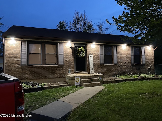 view of front of home with a front lawn