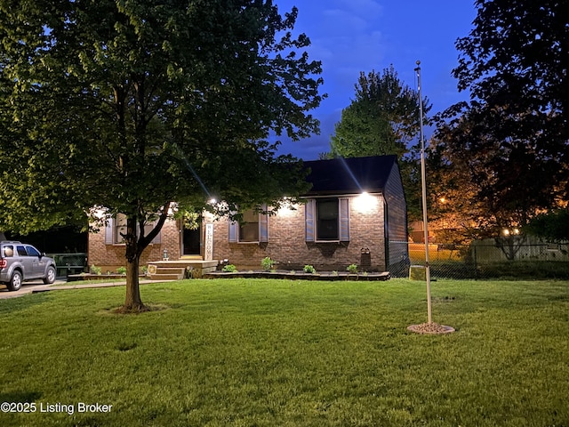 view of front of house with a yard