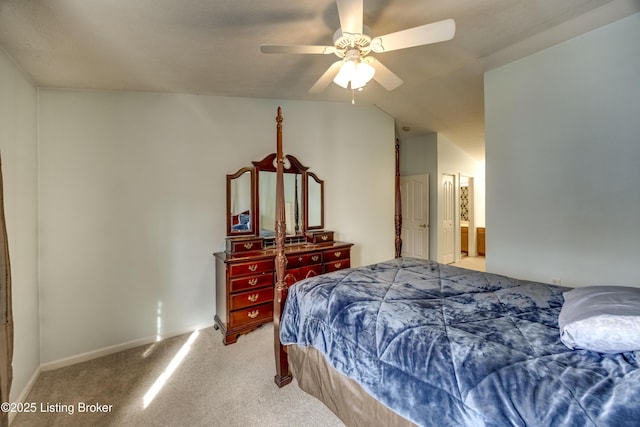 bedroom with ceiling fan, lofted ceiling, and light colored carpet