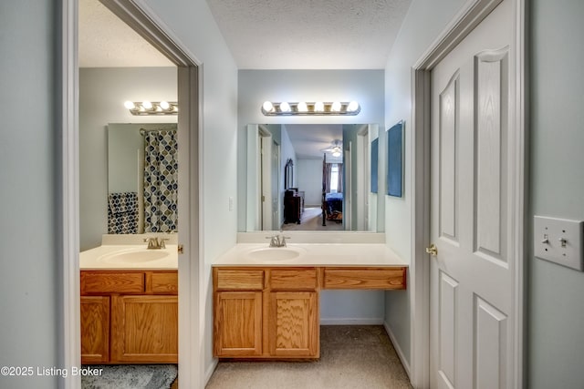 bathroom with vanity and a textured ceiling