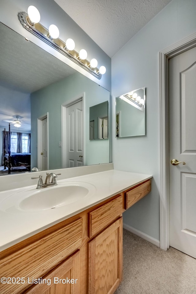 bathroom with vanity and a textured ceiling