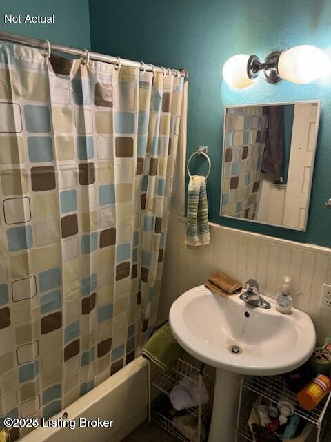 bathroom featuring sink and shower / tub combo