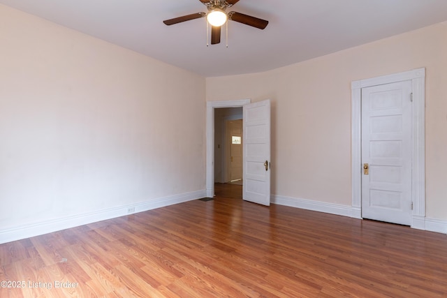 unfurnished room with ceiling fan and hardwood / wood-style floors