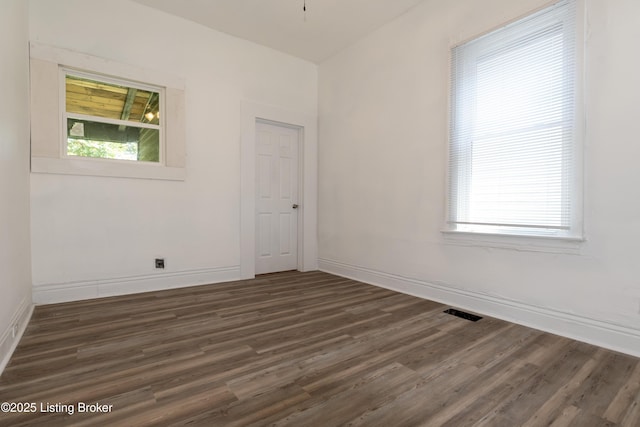 unfurnished room featuring dark hardwood / wood-style flooring