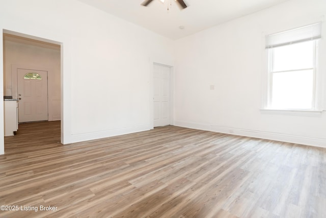 unfurnished room featuring ceiling fan and light hardwood / wood-style floors