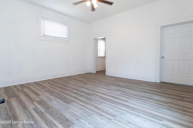 unfurnished room featuring light wood-type flooring and ceiling fan