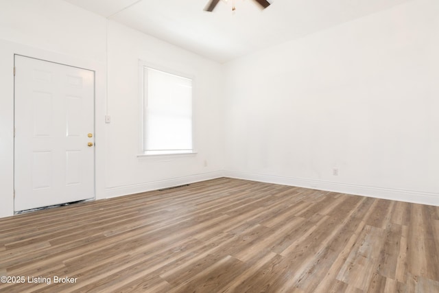 foyer featuring ceiling fan and wood-type flooring