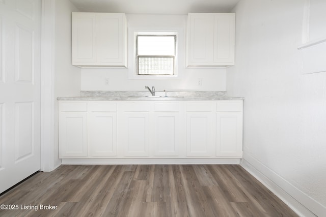 kitchen with white cabinetry and dark hardwood / wood-style flooring