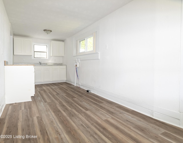 laundry room with sink and light hardwood / wood-style floors