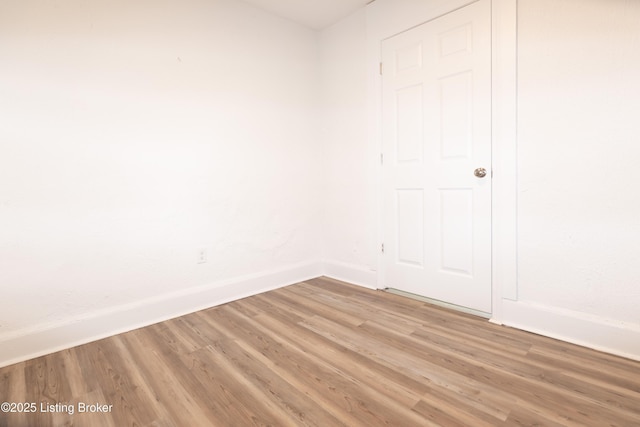 unfurnished room featuring wood-type flooring