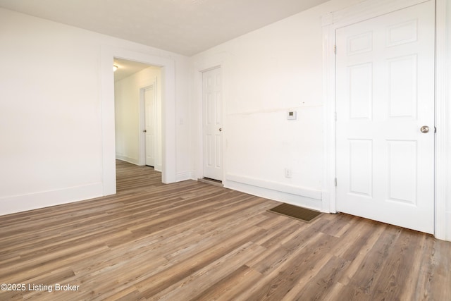 spare room featuring hardwood / wood-style floors