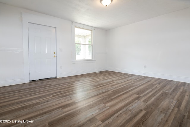 foyer with dark wood-type flooring