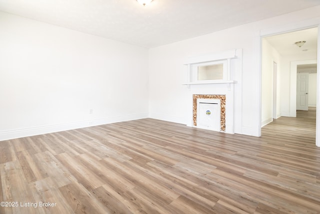 unfurnished living room with light hardwood / wood-style flooring