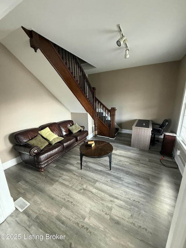 living room featuring track lighting and light wood-type flooring