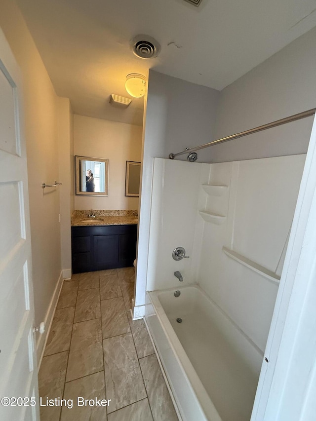 full bath featuring visible vents, baseboards, shower / washtub combination, and vanity