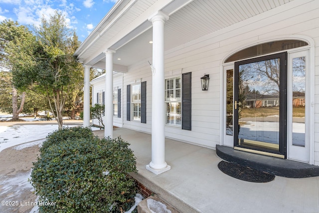 doorway to property featuring a porch