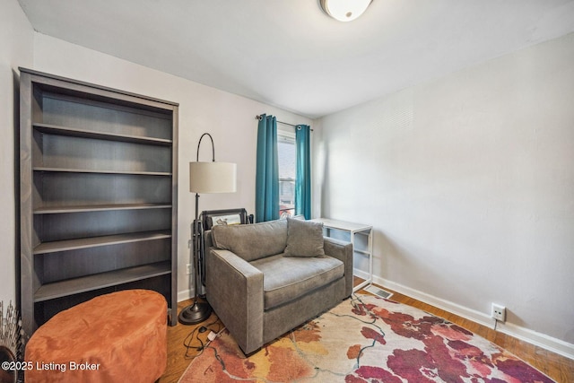 living area featuring hardwood / wood-style floors