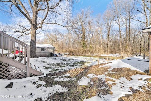 view of yard covered in snow