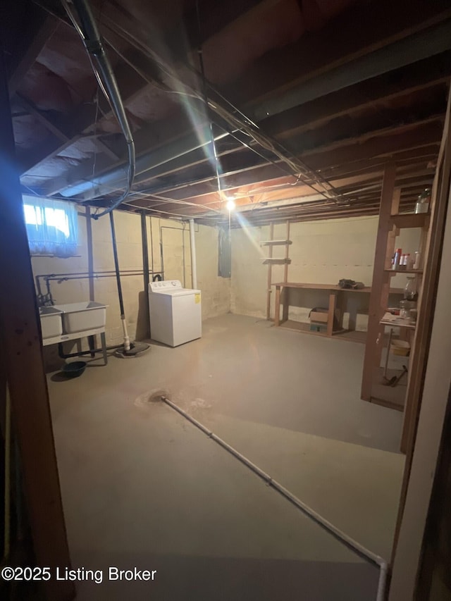 basement with washer / dryer and sink