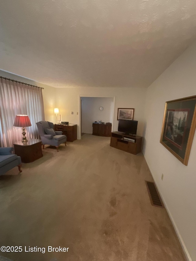 unfurnished living room featuring vaulted ceiling and carpet flooring